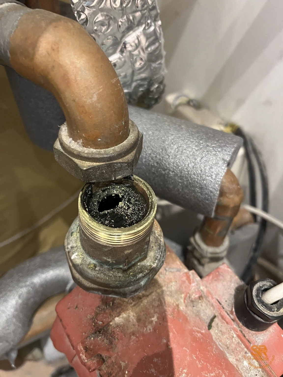 Black magnetite sludge found inside a real central heating fitting